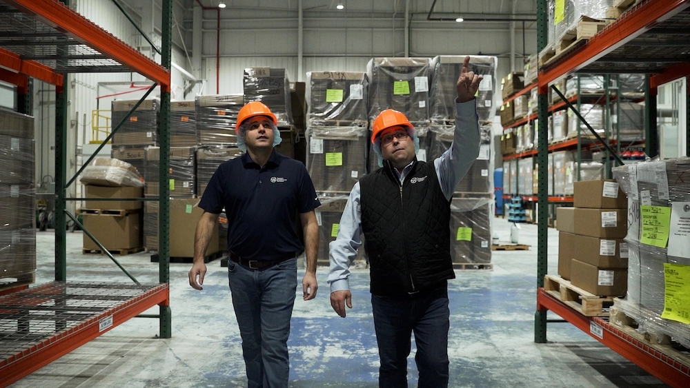 Walking through warehouse.